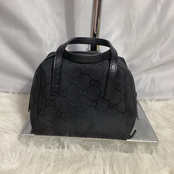 Gucci Handbags - Gucci GG Logo Printed Black Canvas w/ Leather Cosmetic Mini Handbag 1245410959